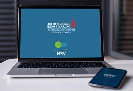 stock photo laptop with uiw logo